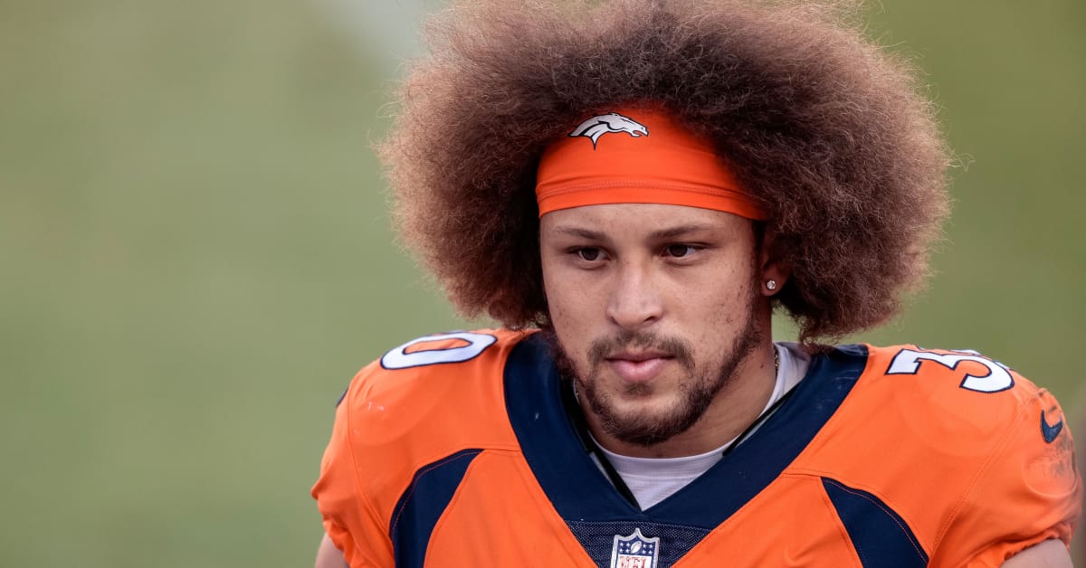 Denver, Colorado, USA. 1st Dec, 2019. Broncos RB PHILLIP LINDSAY starts to  take off his jersey to exchange with a Chargers player during the end of  the game at Empower Field At