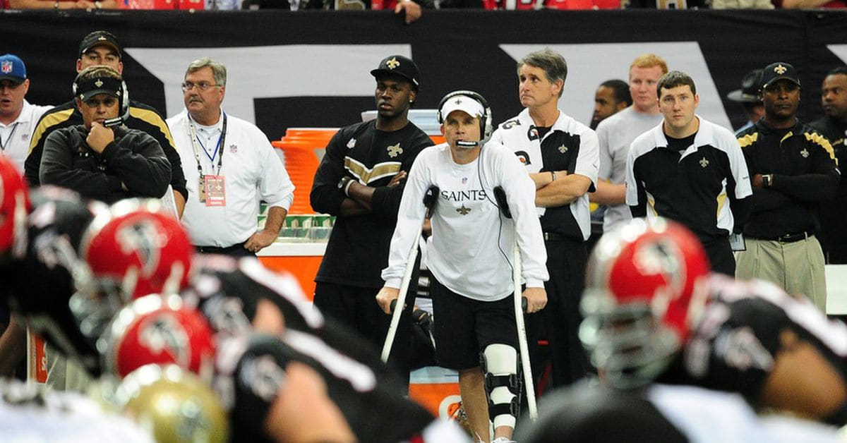 New Orleans Saints head coach Sean Payton watches as New Orleans Saints  quarter back Drew Brees holds aloft the Vince Lombardi Trophy after the  Saints defeated the Indianapolis Colts 31-17 in Super