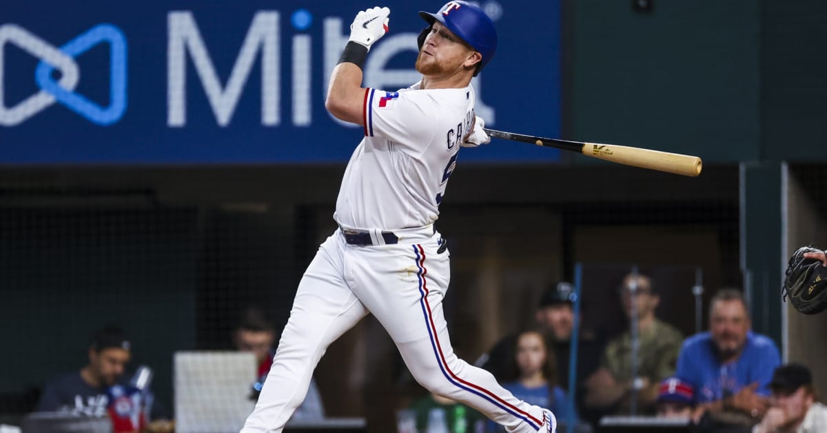 Texas Rangers right fielder Kole Calhoun (56) watches fans