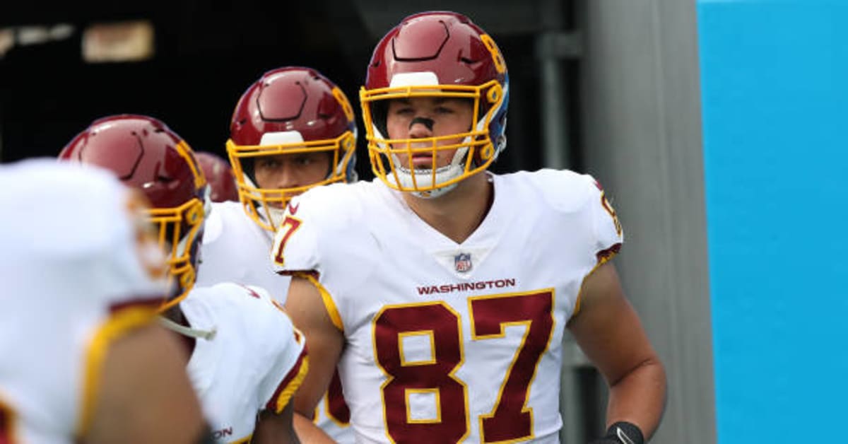 Washington Commanders tight end John Bates (87) runs during an NFL