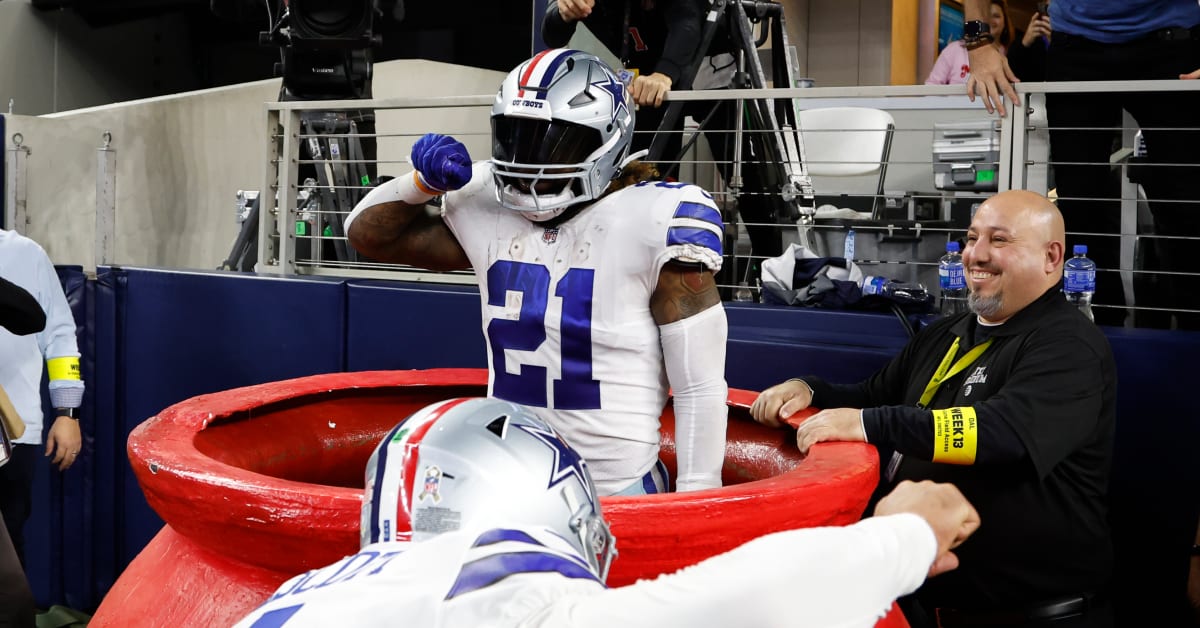 Arlington, United States. 24th Dec, 2022. Dallas Cowboys Ezekiel Ellott  runs as Philadelphia Eagles T.J. Edwards closes in during their NFL game at  AT&T Stadium in Arlington, Texas on Saturday, December 24