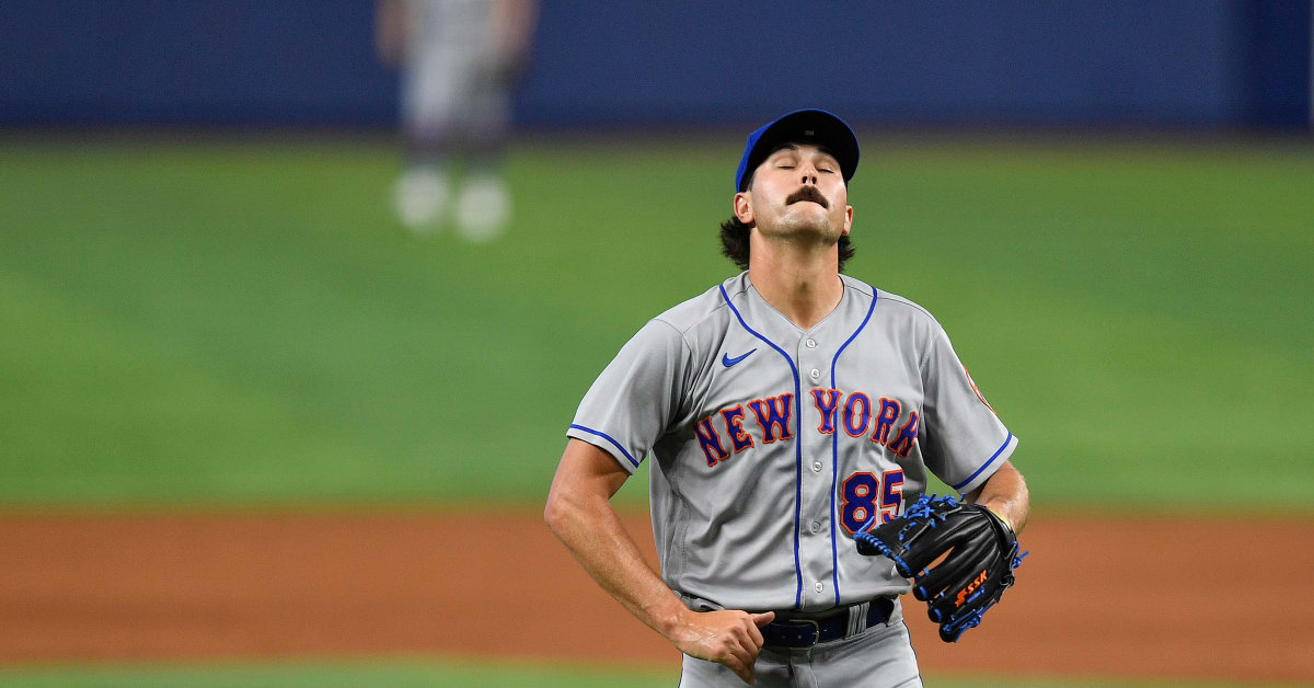 The Mets patch on a player's jersey during a MLB game between the