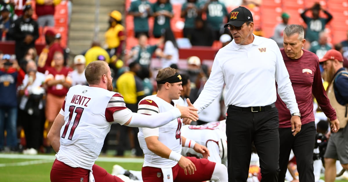 Philadelphia Eagles quarterback Carson Wentz (11) looks at the scoreboard  replay of a fumble his team returned for a touchdown in the fourth quarter  against the Washington Redskins at FedEx Field in