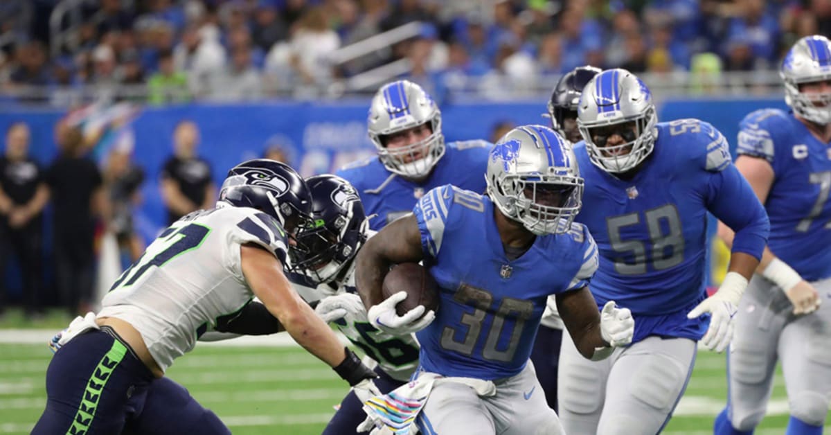 Detroit Lions running back Jamaal Williams runs with teh ball during an NFL  football game against the Seattle Seahawks, Sunday, Jan. 2, 2022, in  Seattle. The Seahawks won 51-29. (AP Photo/Stephen Brashear