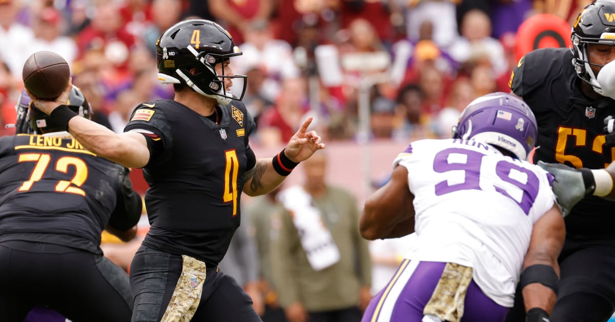 Washington Commanders quarterback Taylor Heinicke (4) in action during the  first half of an NFL football game against the Minnesota Vikings, Sunday,  Nov. 6, 2022, in Landover, Md. (AP Photo/Nick Wass Stock