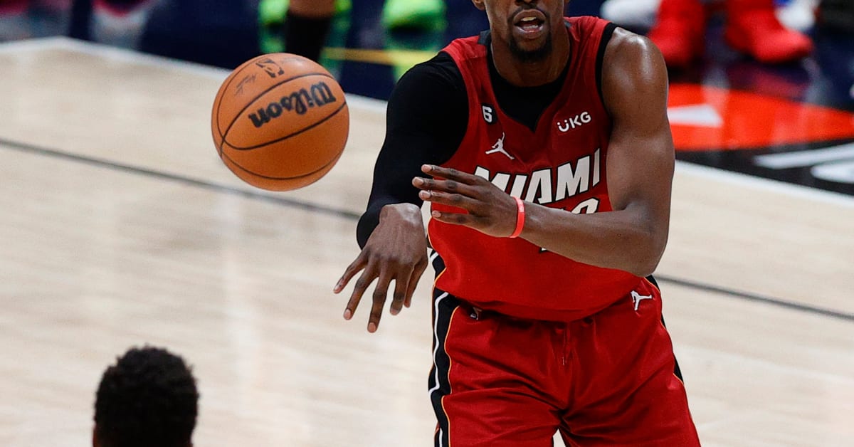 Miami Heat's Bam Ado (13) grabs a rebound next to Miami Heat's