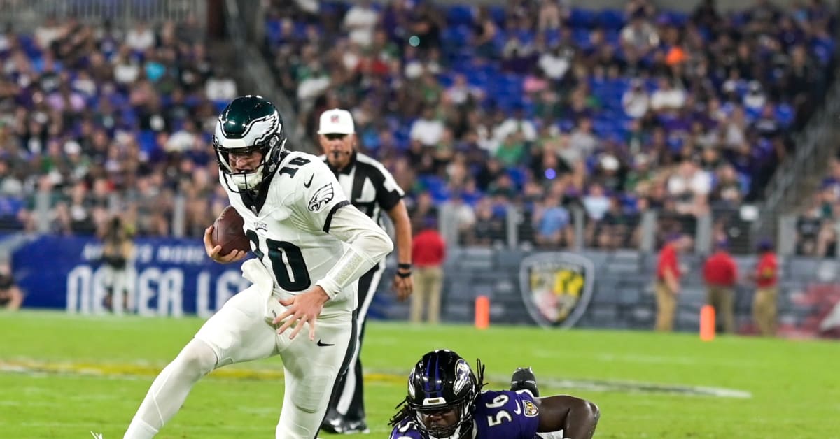 Philadelphia Eagles' Tanner McKee, left, talks to a member of the