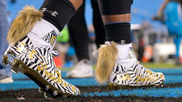pink cam newton cleats