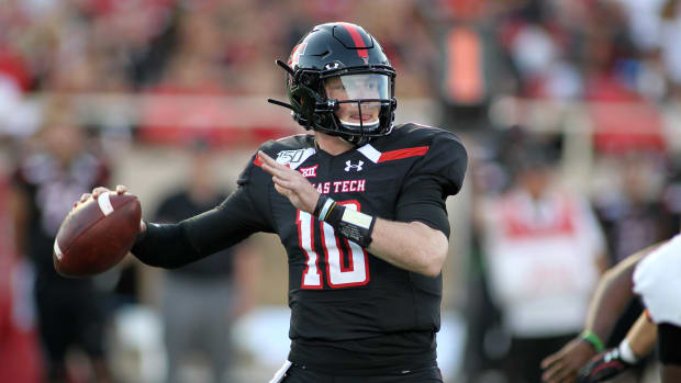 Texas Tech quarterback Alan Bowman attempts a pass during a game.