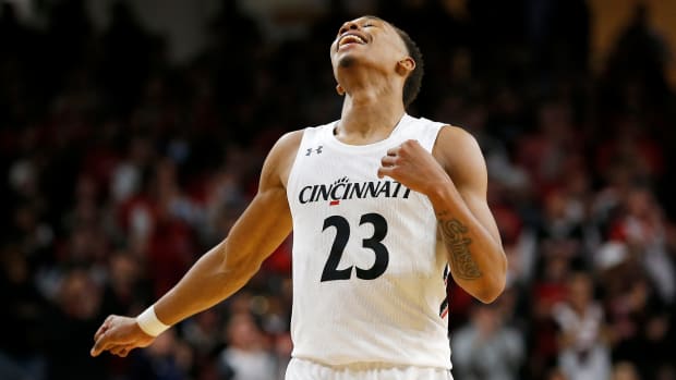 Cincinnati Bearcats guard Mika Adams-Woods (23) reacts to a late whistle in the first half of the NCAA basketball game between the Cincinnati Bearcats and the Evansville Aces at Fifth Third Arena in Cincinnati on Tuesday, Nov. 9, 2021. The Bearcats led 31-22 at halftime of the season-opening game. Evansville Aces At Cincinnati Bearcats