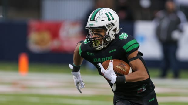 Badin's Braedyn Moore takes the ball down the field during the OHSAA Division III State Final game between the Badin Rams and The Chardon Hilltoppers at Tom Benson Hall of Fame Stadium on Friday Dec. 3, 2021. The game was tied 7-7 at halftime.