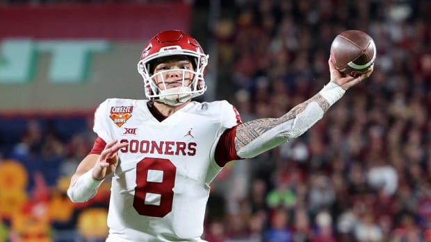 Dec 29, 2022; Orlando, Florida, USA; Oklahoma Sooners quarterback Dillon Gabriel (8) throws a pass against the Florida State Seminoles in the fourth quarter during the 2022 Cheez-It Bowl at Camping World Stadium.