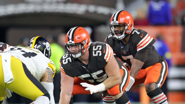 Pittsburgh Steelers quarterback Kenny Pickett (8) looks to pass while  pressured by Cleveland Browns defensive end Alex Wright (94) during the  first half of an NFL football game in Pittsburgh, Sunday, Jan.