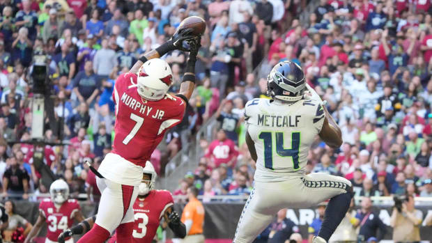 Nov 6, 2022; Phoenix, Ariz., United States; Arizona Cardinals cornerback Byron Murphy Jr. (7) breaks up a pass intended for Seattle Seahawks wide receiver DK Metcalf (14) during the second quarter at State Farm Stadium.