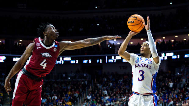 Kansas guard Dajuan Harris Jr. attempts a shot against Arkansas guard Davonte Davis during an NCAA men s basketball tournament second round basketball game on Saturday, March 18, 2023, at Wells Fargo Arena, in Des Moines, Iowa.