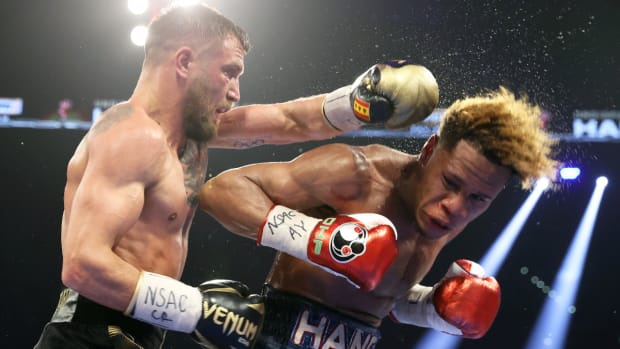 Vasiliy Lomachenko scores a punch on Devin Haney in their undisputed lightweight title fight in Las Vegas.