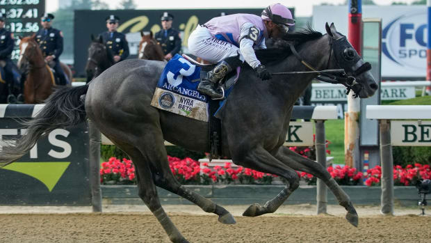 Arcangelo, with jockey Javier Castellano, crosses the finish line to win the Belmont Stakes horse race.