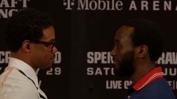 Welterweight boxing champions Errol Spence Jr. and Terence Crawford staredown at the first press conference for their title unification bout.