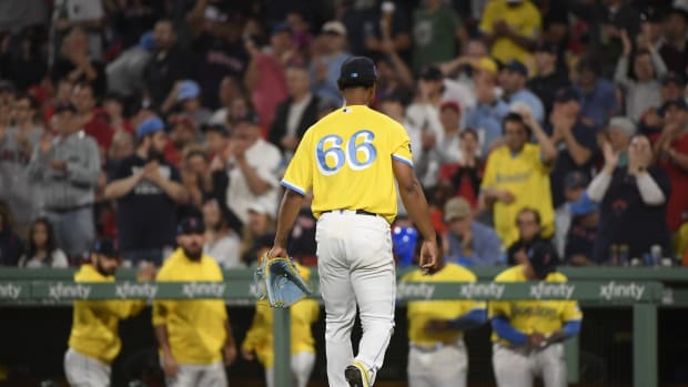 Why are the Boston Red Sox wearing yellow and blue uniforms today?