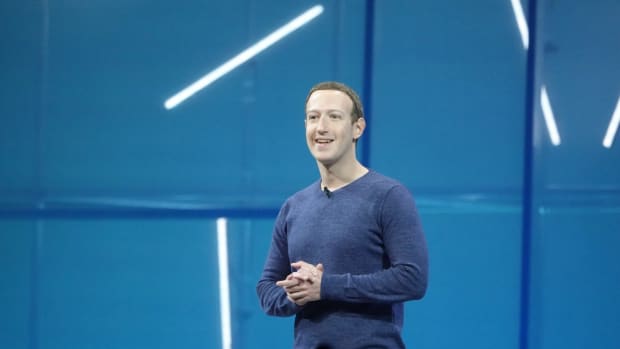 Facebook (Meta) founder Mark Zuckerberg speaks to an audience on stage during a conference.