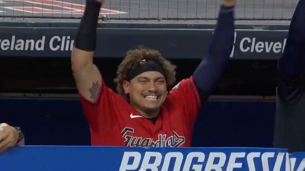 Josh Naylor smiles in the dugout