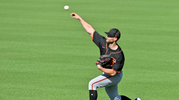 SF Giants pitcher Sam Delaplane throws during a Spring Training workout at Scottsdale Stadium. (2023)