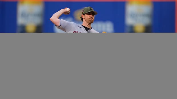 Cleveland Guardians pitcher Shane Bieber (57) pitches the ball