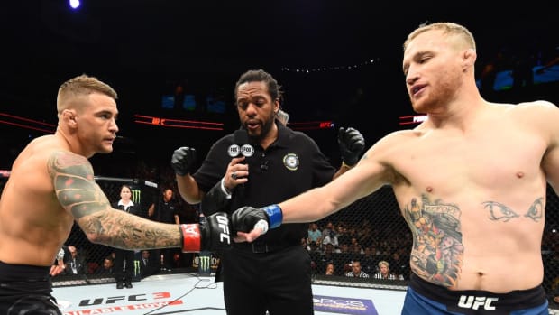 Former interim UFC lightweight titleholders Dustin Poirier and Justin Gaethje touch gloves before their 2018 showdown.