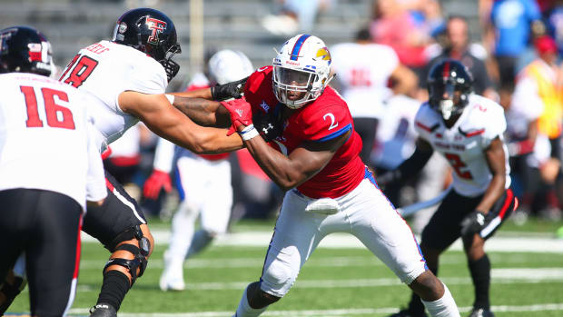 Oct 7, 2017; Lawrence, KS, USA; Kansas Jayhawks defensive end Dorance Armstrong Jr. (2) rushes against Texas Tech Red Raiders offensive lineman Terence Steele (78) in the second half at Memorial Stadium. Mandatory Credit: Jay Biggerstaff-USA TODAY Sports