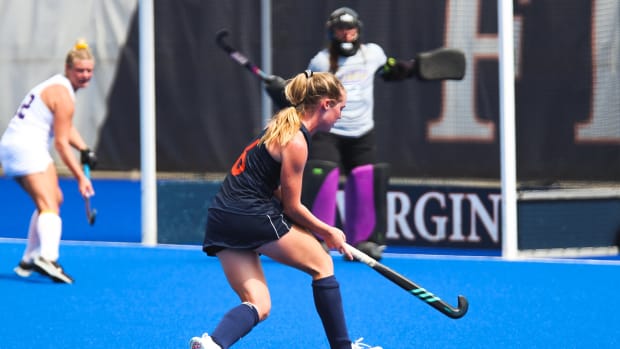 Virginia field hockey midfielder Lauren Kenah attempts a shot.