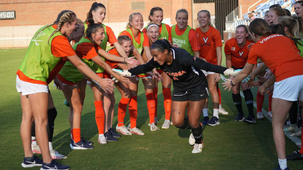 Goalkeeper Cayla White and the Virginia women's soccer team prepare for their match against North Carolina in Chapel Hill.