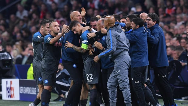 Napoli's players and staff pictured celebrating during a 6-1 win over Ajax in October 2022