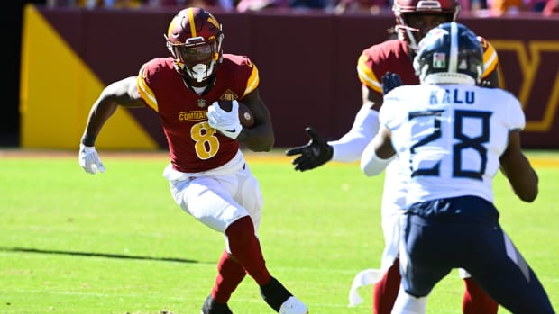 Oct 9, 2022; Landover, Maryland, USA; Washington Commanders running back Brian Robinson (8) carries the ball against the Tennessee Titans during the second half at FedExField.