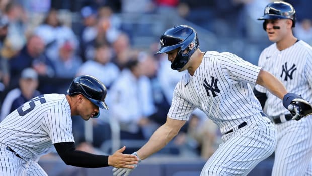 Yankees hitters Gleyber Torres and Giancarlo Stanton celebrate after Stanton hit a three-run home run off the Guardians in the first inning of Game 5 of the ALDS.