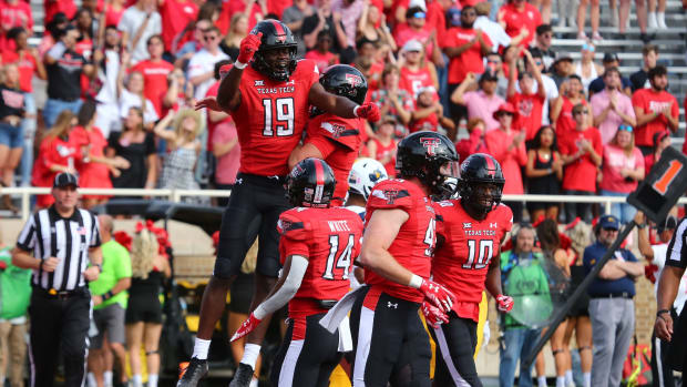 Oct 22, 2022; Lubbock, Texas, USA; Texas Tech Red Raiders wide receiver Loic Fouonji (19) reacts after scoring a touchdown against the West Virginia Mountaineers in the second half at Jones AT&T Stadium and Cody Campbell Field.