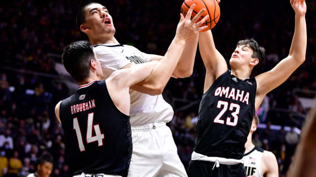 Nov 26, 2021; West Lafayette, Indiana, USA; Purdue Boilermakers center Zach Edey (15) fights for a rebound with Nebraska-Omaha Mavericks center Dylan Brougham (14) and Nebraska-Omaha Mavericks forward Frankie Fidler (23) during the second half at Mackey Arena. Mandatory Credit: Marc Lebryk-USA TODAY Sports