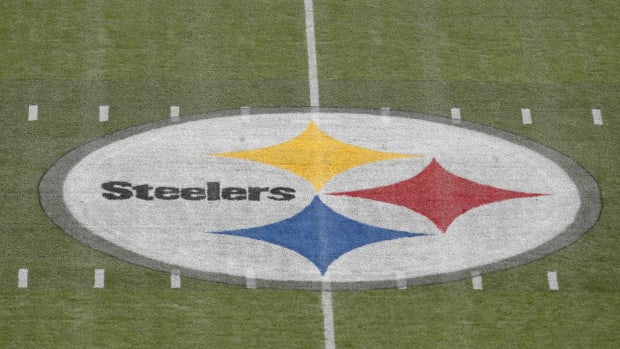 The Steelers logo painted on the field at Acrisure Stadium in Pittsburgh.