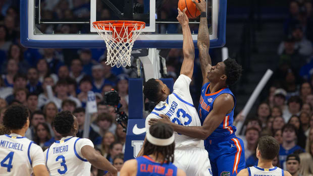 Kentucky's Ugonna Onyenso (33) blocked the shot of Florida's Tyrese Samuel (4) during first half action as the Kentucky Wildcats battled the Florida Gators Wednesday night at Rupp Arena. Jan. 31, 2024