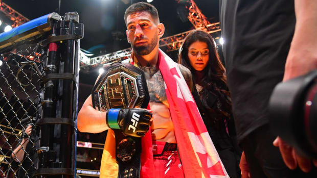 Feb 17, 2024; Anaheim, California, USA; Ilia Topuria celebrates his championship victory against Alexander Volkanovski during UFC 298 at Honda Center. Mandatory Credit: Gary A. Vasquez-USA TODAY Sports