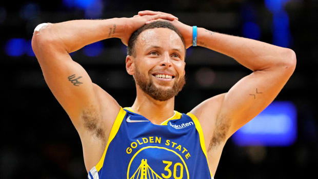 Warriors guard Stephen Curry reacts to the team winning the 2022 NBA finals.