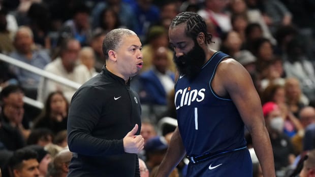 Los Angeles Clippers coach Tyronn Lue instructs guard James Harden