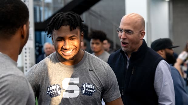 Penn State coach James Franklin encourages running back Nicholas Singleton during a max-out lifting session at the Lasch Football Building.