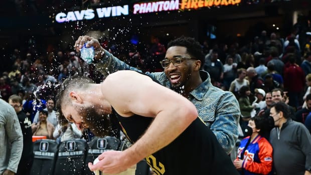 Mar 5, 2024; Cleveland, Ohio, USA; Cleveland Cavaliers guard Donovan Mitchell pours water on forward Dean Wade (32) after the Cavaliers beat the Boston Celtics at Rocket Mortgage FieldHouse.