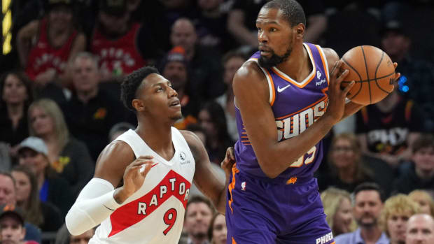 Toronto Raptors guard RJ Barrett (9) guards Phoenix Suns forward Kevin Durant (35) during the first half at Footprint Center.