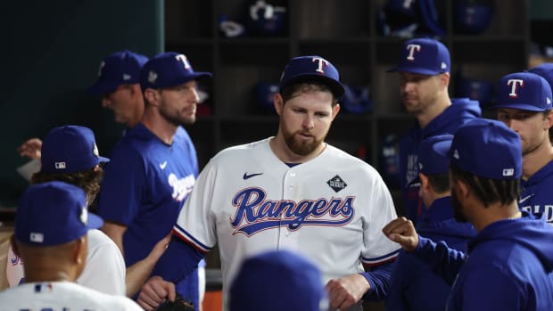 Oct 28, 2023; Arlington, TX, USA; Texas Rangers starting pitcher Jordan Montgomery (52) reacts in the dugout after leaving in the in the seventh inning against the Arizona Diamondbacks in game two of the 2023 World Series at Globe Life Field.