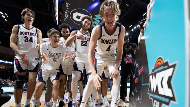 Gonzaga Bulldogs guard Dusty Stromer (4) applies the advancing team sticker on the bracket against the San Francisco Dons after the game in the semifinals of the WCC Basketball Championship at Orleans Arena in Las Vegas on March 11, 2024.