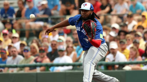 Mar 5, 2024; Bradenton, Florida, USA; Toronto Blue Jays first baseman Vladimir Guerrero Jr. (27) catches the ball at first base for an out during the first inning against the Pittsburgh Pirates at LECOM Park.