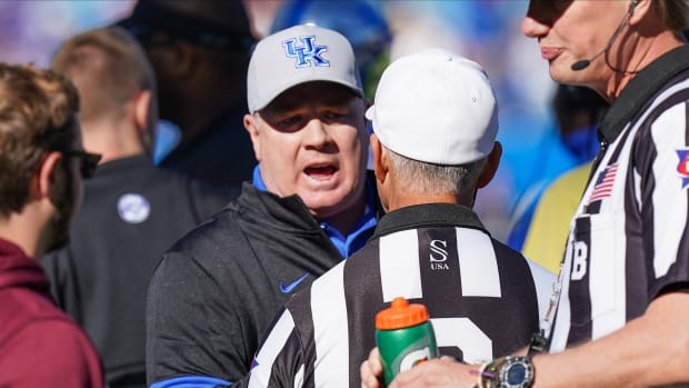 Dec 31, 2019; Charlotte, North Carolina, USA; Kentucky Wildcats head coach Mark Stoops argues a call with the official during the second quarter against the Virginia Tech Hokies of the Belk Bowl at Bank of America Stadium. Mandatory Credit: Jim Dedmon-USA TODAY Sports