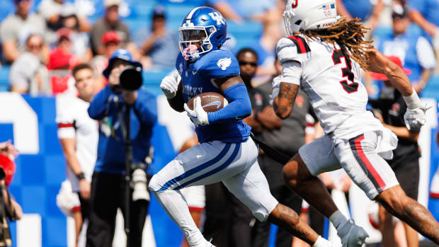 Sep 2, 2023; Lexington, Kentucky, USA; Kentucky Wildcats running back Ray Davis (1) runs the ball into the end zone for a touchdown during the fourth quarter against the Ball State Cardinals at Kroger Field. Mandatory Credit: Jordan Prather-USA TODAY Sports