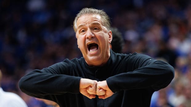 Jan 28, 2023; Lexington, Kentucky, USA; Kentucky Wildcats head coach John Calipari talks with a referee during the first half against the Kansas Jayhawks at Rupp Arena at Central Bank Center. Mandatory Credit: Jordan Prather-USA TODAY Sports